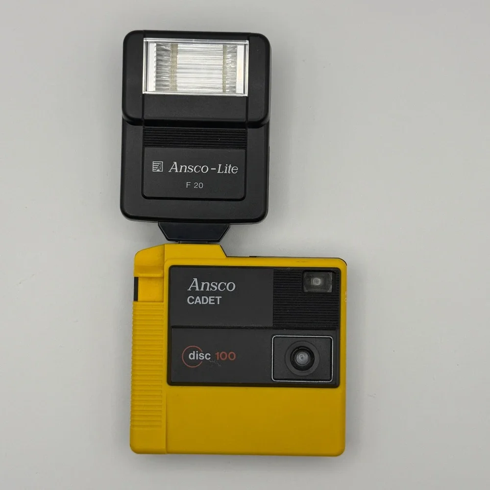 Ansco Cadet Disc 100 Camera with Ansco-Lite F‎ 20 Flash Yellow Vintage 80s Tech